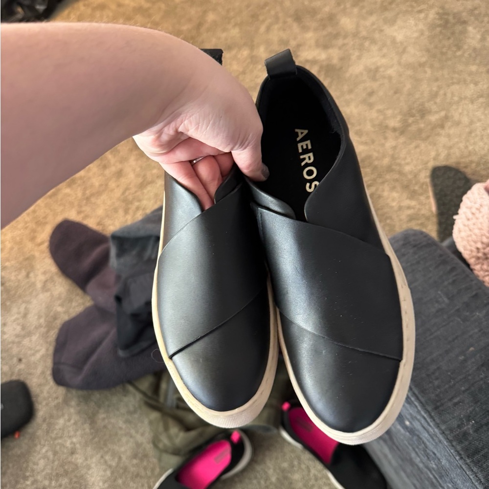 Black and white slip ons
